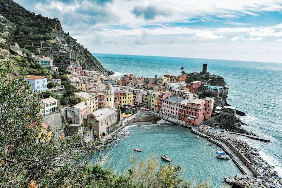 Aerial view of Vernazza harbor and colorful buildings in Cinque Terre, Italy.
