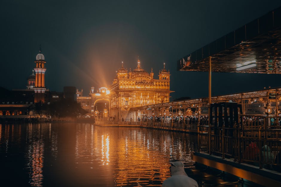 Night view of the Golden Temple reflecting in the water, Amritsar, India.