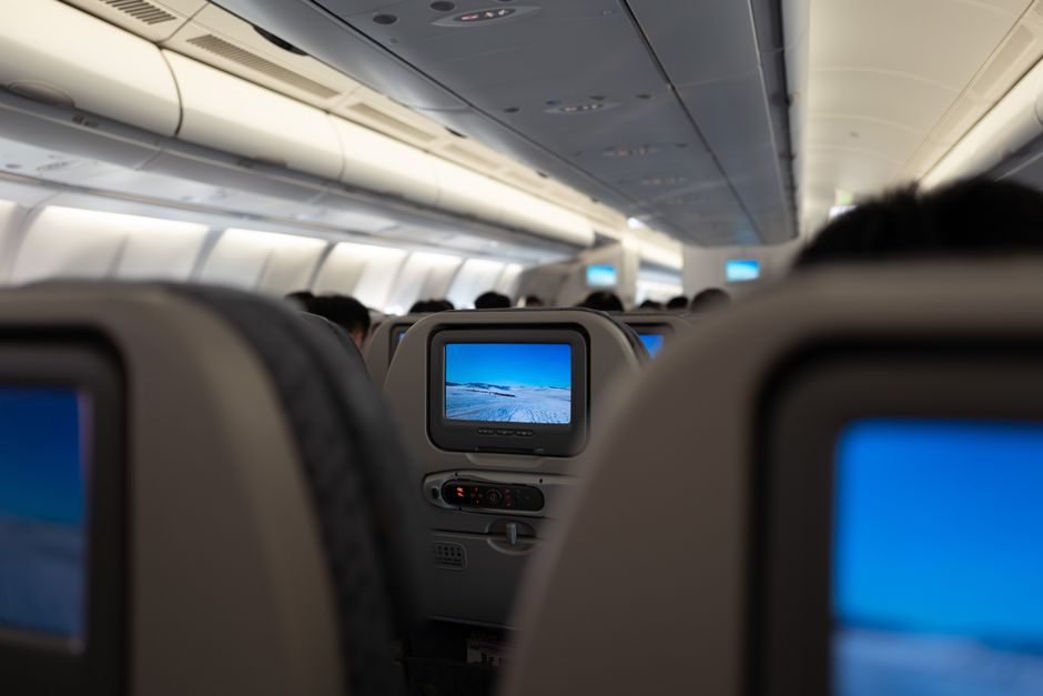 In-flight entertainment screens on a long-haul flight