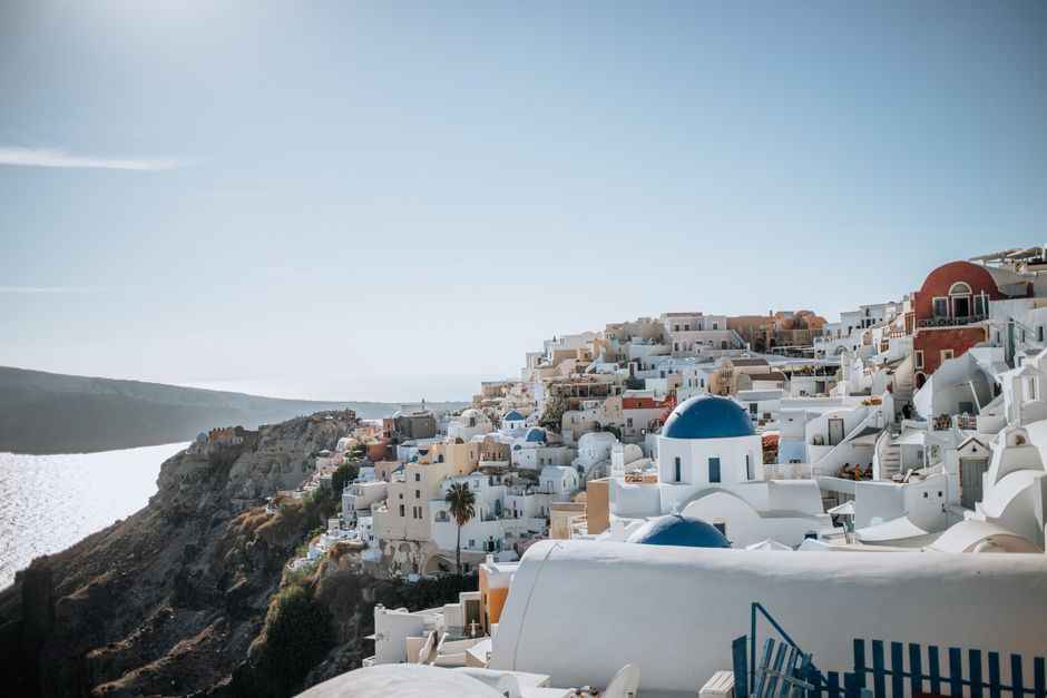 A stunning capture of Santorini's iconic white and blue buildings by the sea.