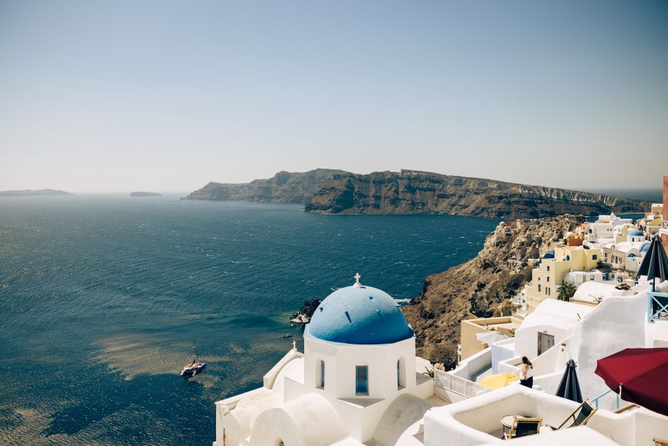 Capture the breathtaking sea view and charming architecture of Santorini with its iconic blue-domed buildings.