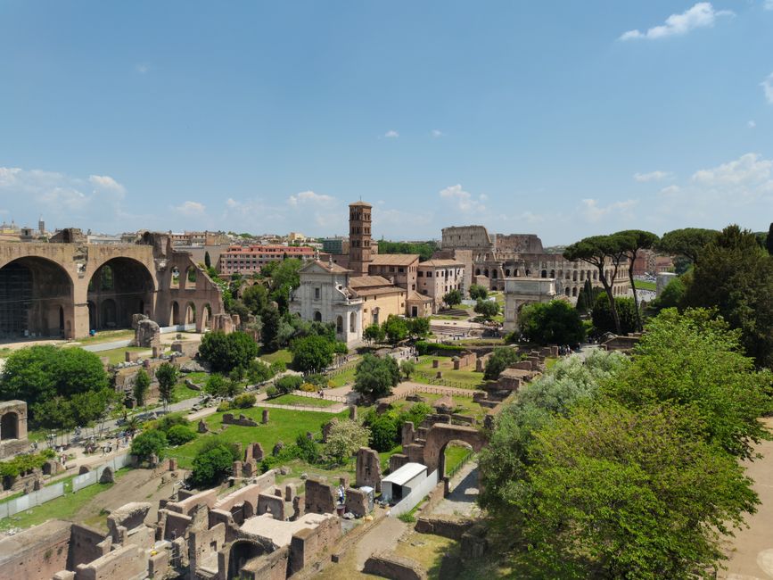 Explore the historical Roman Forum ruins in Rome, Italy from an aerial perspective.