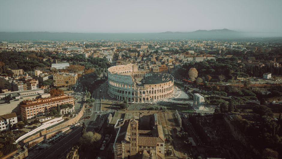 Breathtaking aerial view of the iconic Colosseum in Rome, Italy during daytime.
