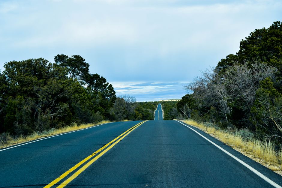 A scenic highway surrounded by lush greenery at Grand Canyon West, Arizona, perfect for travel and adventure.