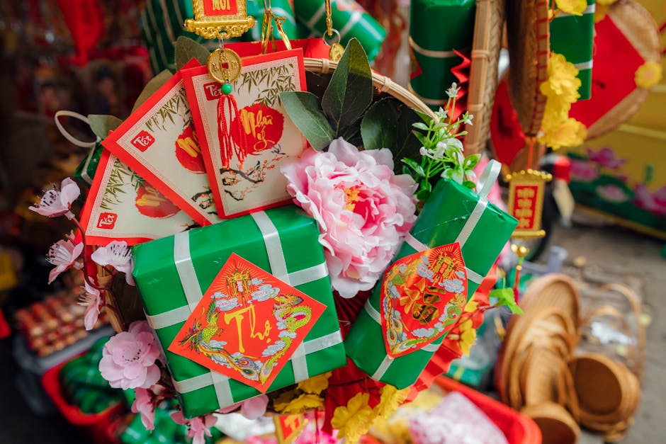 Close-up of celebratory Tet decorations showcasing traditional Vietnamese gift boxes and floral display.