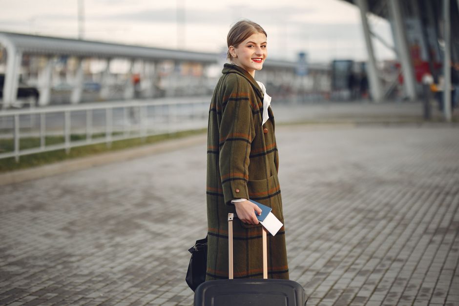 Traveler with backpack smiling ready for adventure